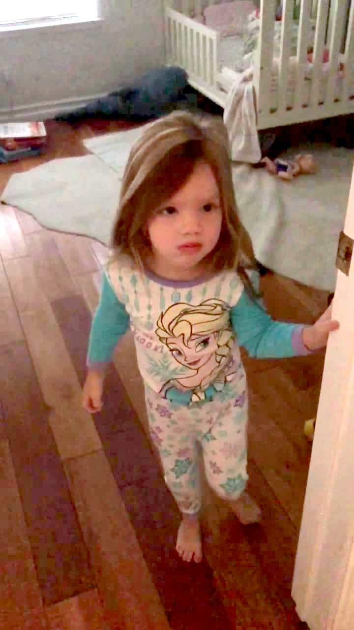 Video thumbnail showing: A tot girl opens her bedroom door in the morning and her mom and dad surprise her and sing \